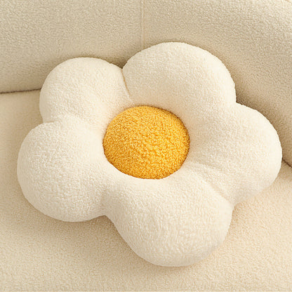 Single cream sherpa flower-shaped cushion with five rounded petals and a textured yellow center.