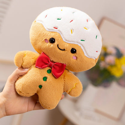 Hand holding a frosted gingerbread plush