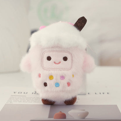 Strawberry bubble tea cup plush keychain, pale pink and fluffy with a smiley face