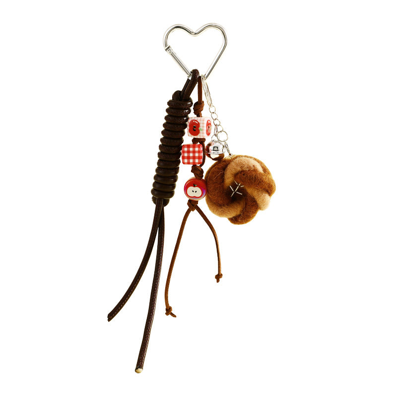 Knot bun bag charm on a heart clip