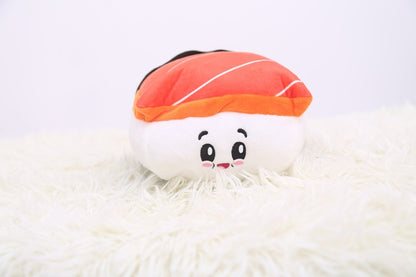 One plush sushi toy with white base and smiling face, orange-striped top and black back on white fur.