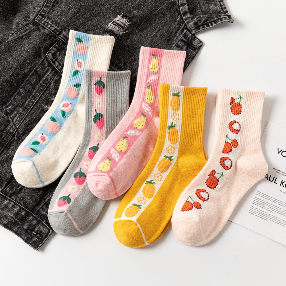 Five ribbed ankle socks in cream, grey, pink, yellow and blush, each with a vertical fruit motif.