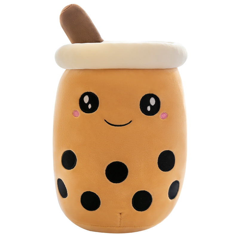 One plush bubble tea pillow, tan body, cream lid and brown straw, smiling face and black boba dots