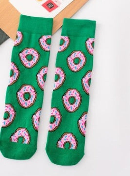 Green ankle socks adorned with colourful donut designs, featuring pink icing and colourful sprinkles.