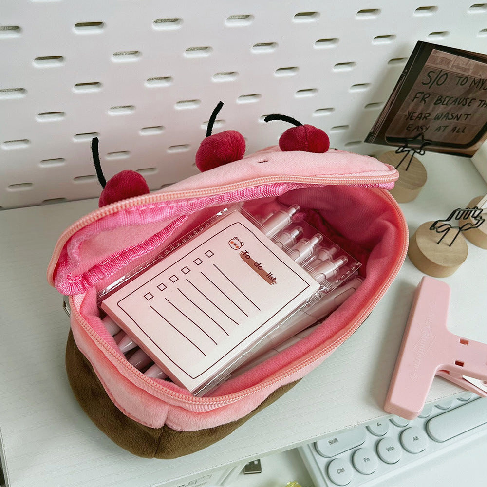 Cherry cake pencil case unzipped with stationery inside