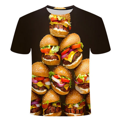 3D T-shirt featuring a stack of colourful hamburgers with lettuce, tomatoes, and onions on a dark background.