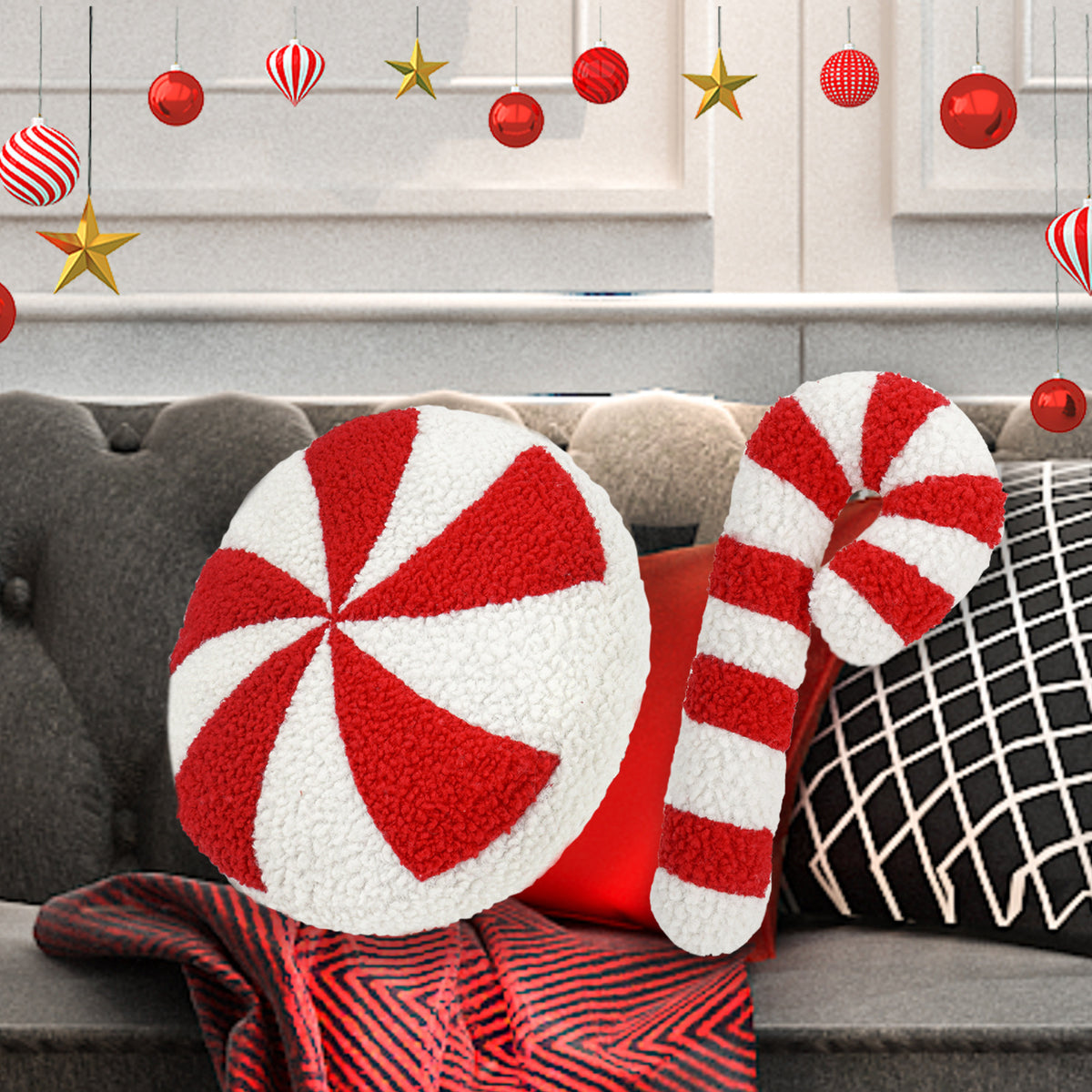 Peppermint and candy cane cushions on a grey sofa