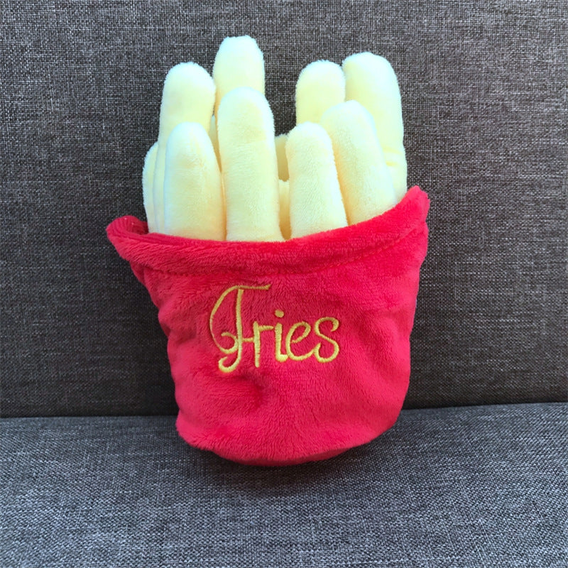 One plush red fries container holding yellow stuffed fries with 'Fries' embroidered, on gray couch.