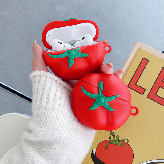 Two tomato AirPods cases held in a hand, one open