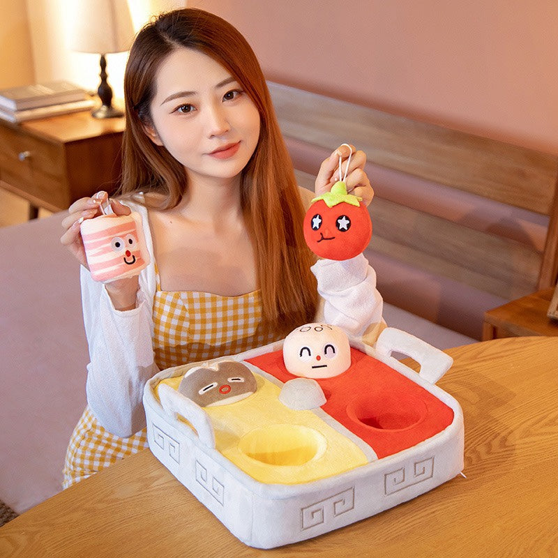Woman holding plush hot pot ingredients