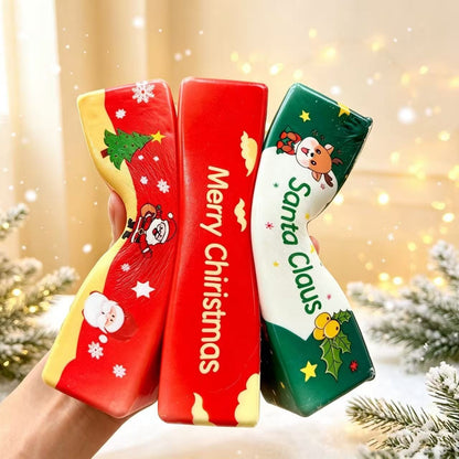 Three Christmas butter stick squishies being squeezed