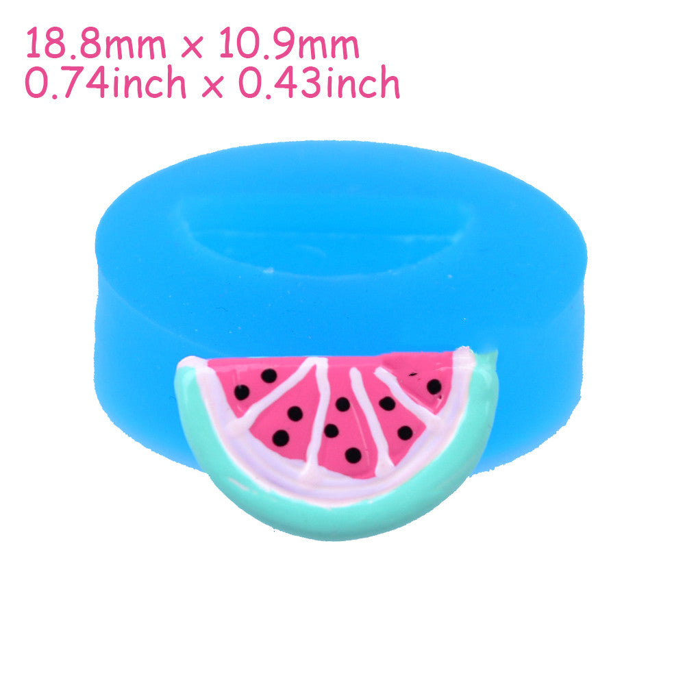 Blue round silicone mold with one small pink-and-mint watermelon slice charm on white background.