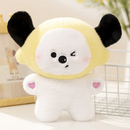 One plush toy with a white body, yellow round hood, black ears, winking face and pink heart patches on arms.