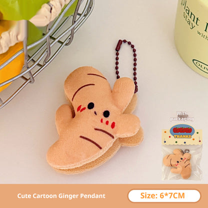 One tan plush ginger-shaped keychain with black eyes, red cheek marks, brown stripes and a brown chain.