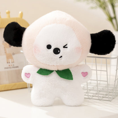 One plush with pale-pink head, winking face, black ears, white body, green collar and pink heart hands.