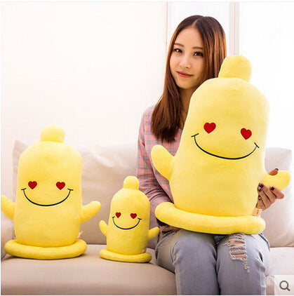 Three yellow plush toys (small, medium, large) with red heart eyes, black smiles, stubby arms, round bases.