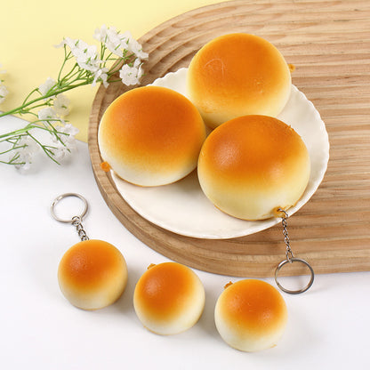 Bun squishy keychains on a plate with flowers