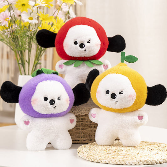 Three white plush dolls with black ears in red, purple and yellow hoods, winking with pink heart arm patches.