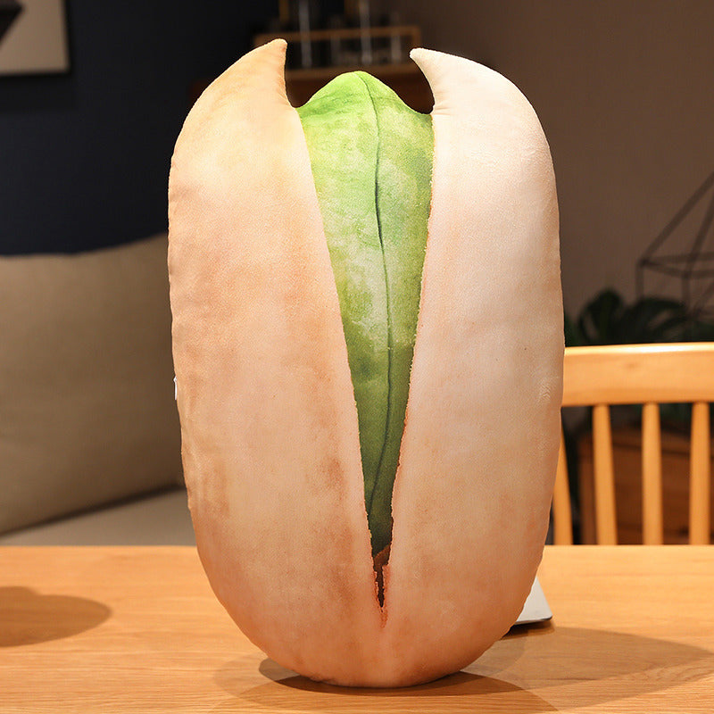 Giant pistachio pillow on a table