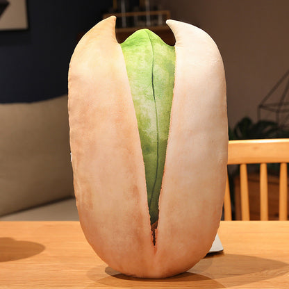 Giant pistachio pillow on a table