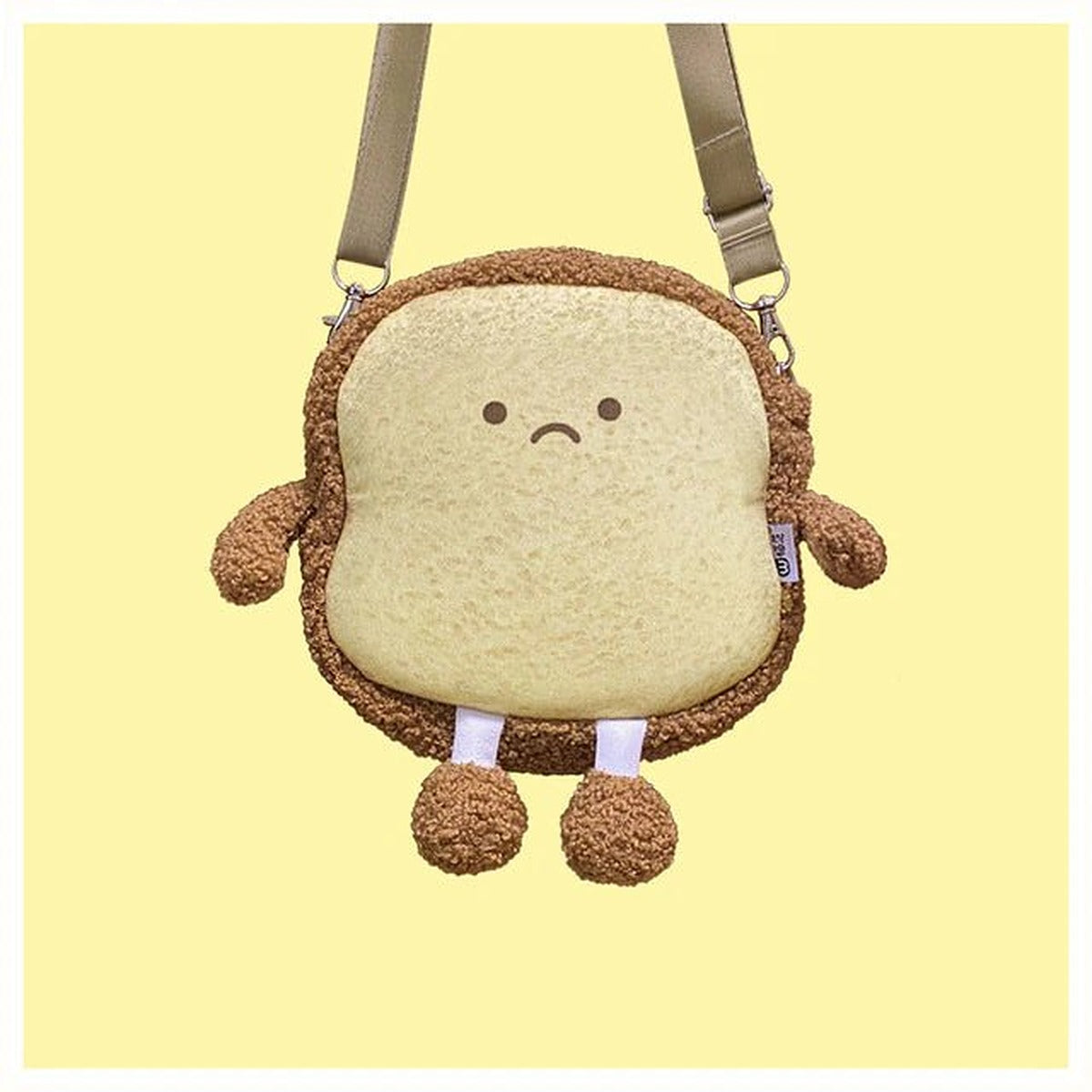 Fluffy brown toast bread bag with a frowning face on a yellow background