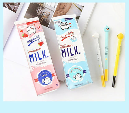 Pink strawberry and blue original milk carton pencil cases standing with gel pens