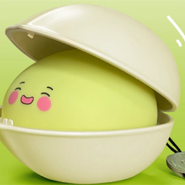 Pistachio night light with a smiling face