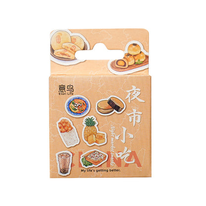 One peach-orange sticker pack box showing eight illustrated night-market snacks (pineapple, bubble tea, bun...