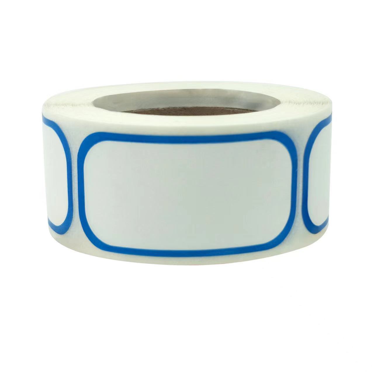 One roll of white rectangular stickers with rounded corners and thin blue borders on a cardboard core.