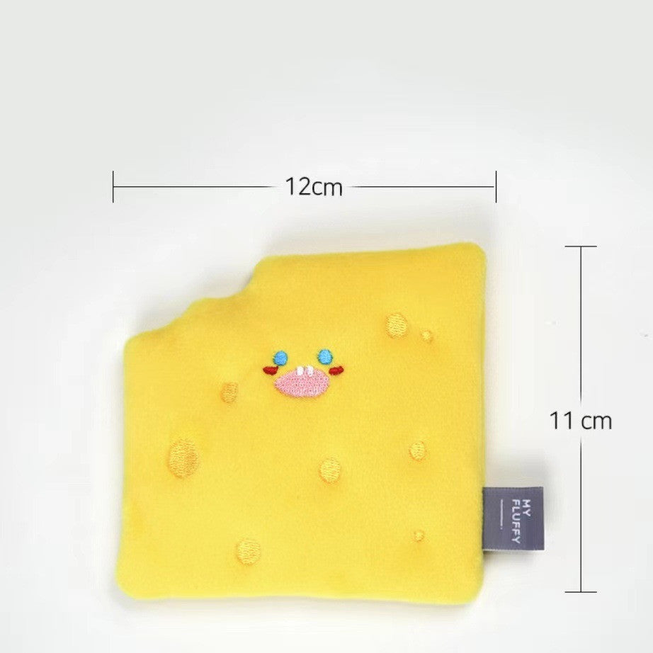 Yellow cheese wedge-shaped dog toy with crinkle texture and cute face, measuring 12cm by 11cm.