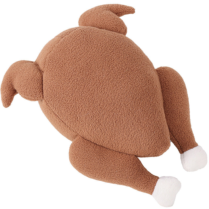 One brown plush roast-chicken dog toy with two legs, wings, curled tail and white bone ends.