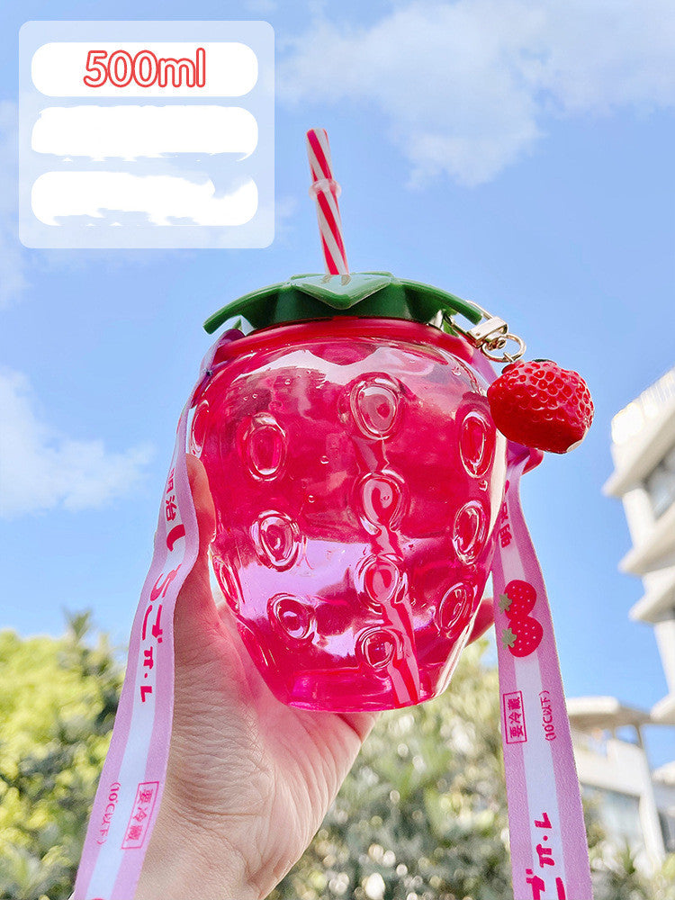One translucent pink strawberry-shaped bottle with green lid, striped straw, strawberry charm and pink strap.