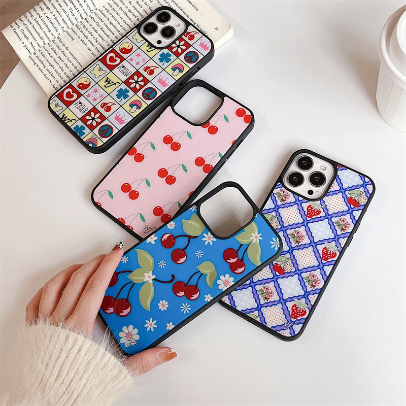 Four iPhone cases displayed, featuring cherry blossom, floral, and cherry patterns in vibrant pastel colours.
