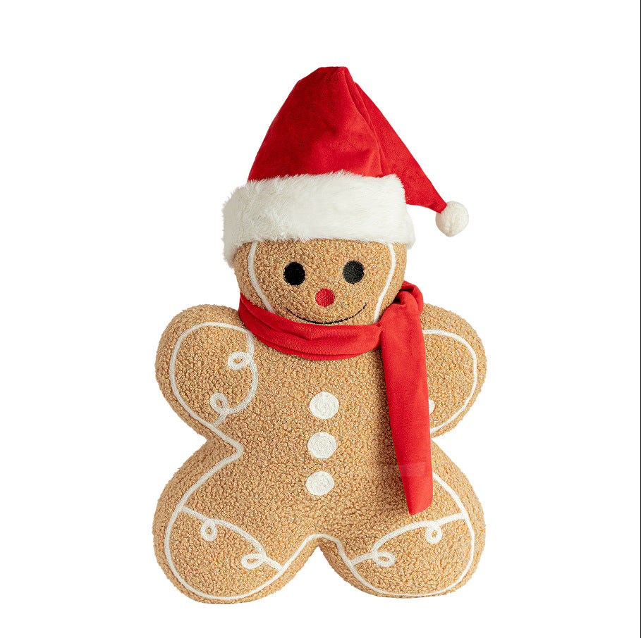 Gingerbread cushion in a Santa hat and red scarf