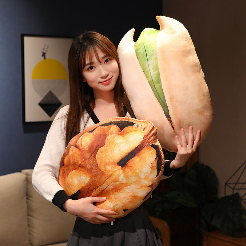 Woman hugging giant pistachio and walnut pillows