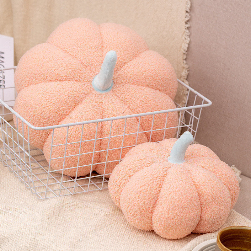 Blossom pink teddy pumpkin plush cushions in a wire basket in two sizes