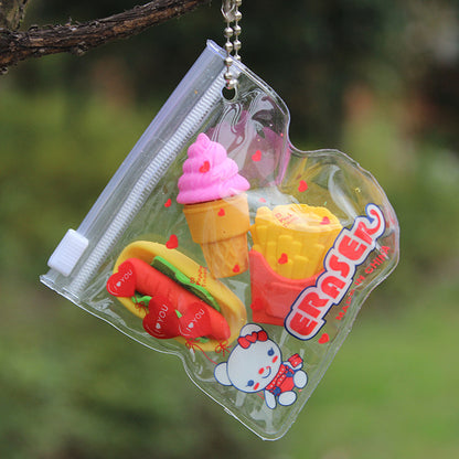 Clear zip pouch with ball chain holding three erasers: pink ice cream cone, red fries, red hot dog.