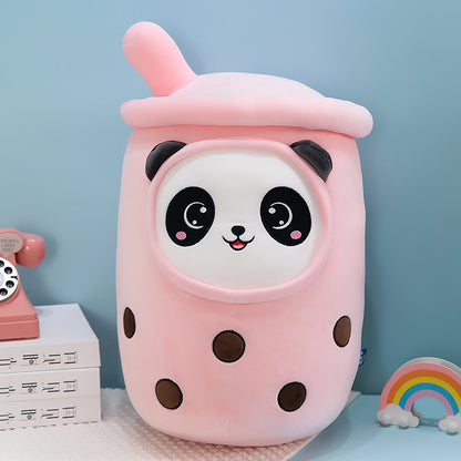 One pink plush milk-tea cup pillow with a white panda face, black ears, brown boba dots and top straw.