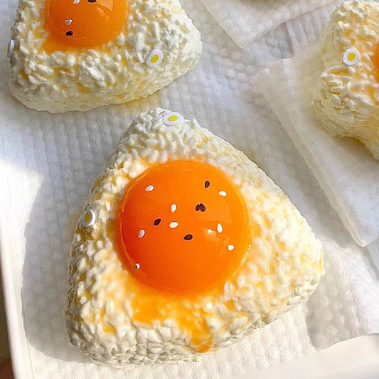 Egg yolk rice ball squishy with sesame seeds