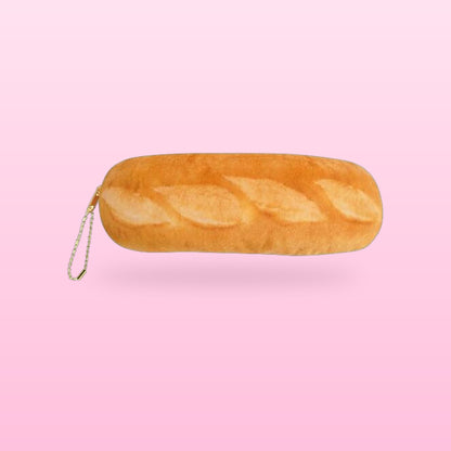 Baguette plush pencil case with a zip pull chain, on a bubblegum pink background