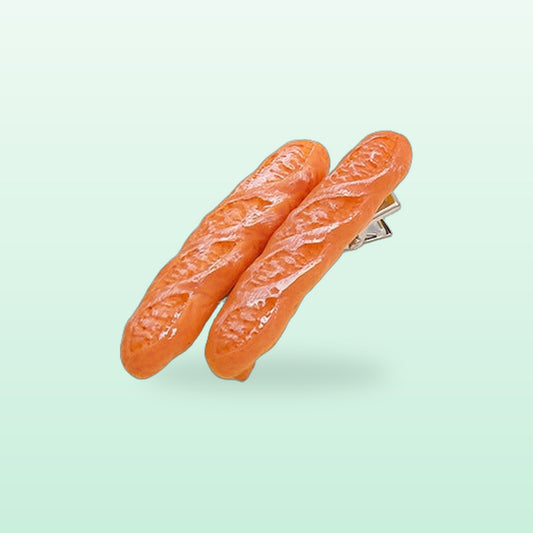Baguette hair clip with two mini baguettes, on a soft mint background