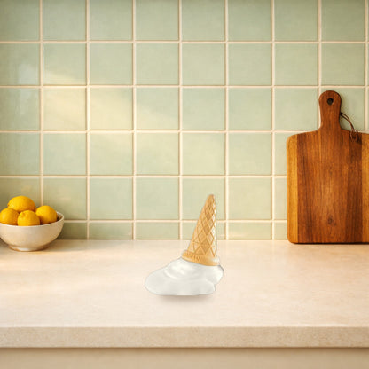 Melting ice cream cone door stopper on a kitchen worktop