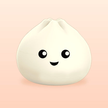 Smiley bao bun night light in soft white silicone on a peach background
