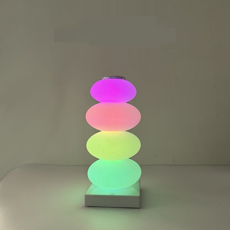 Candy lamp lit in pink, red, yellow and green