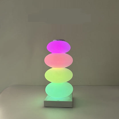 Candy lamp lit in pink, red, yellow and green
