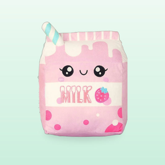 Strawberry milk carton plush pillow in pink with a smiling face and a striped straw, on a mint green background