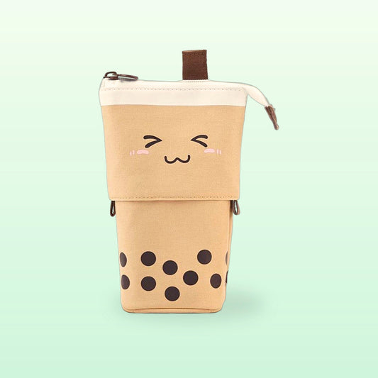 Brown boba milk tea pen pouch with a squinting smile, standing tall on a soft mint background