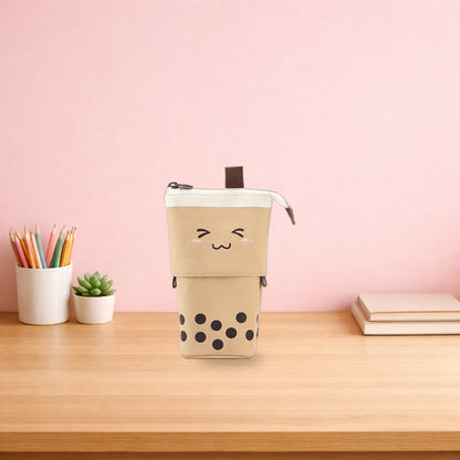 Brown boba milk tea pen pouch standing on a light oak desk
