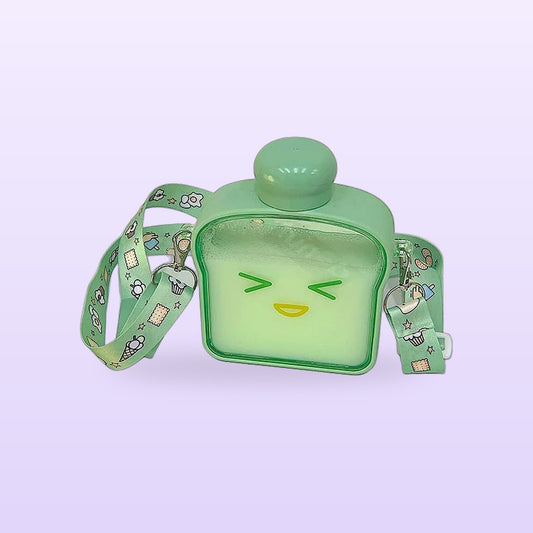 Green bread loaf water bottle with a squinting face and a printed shoulder strap, on a lilac background