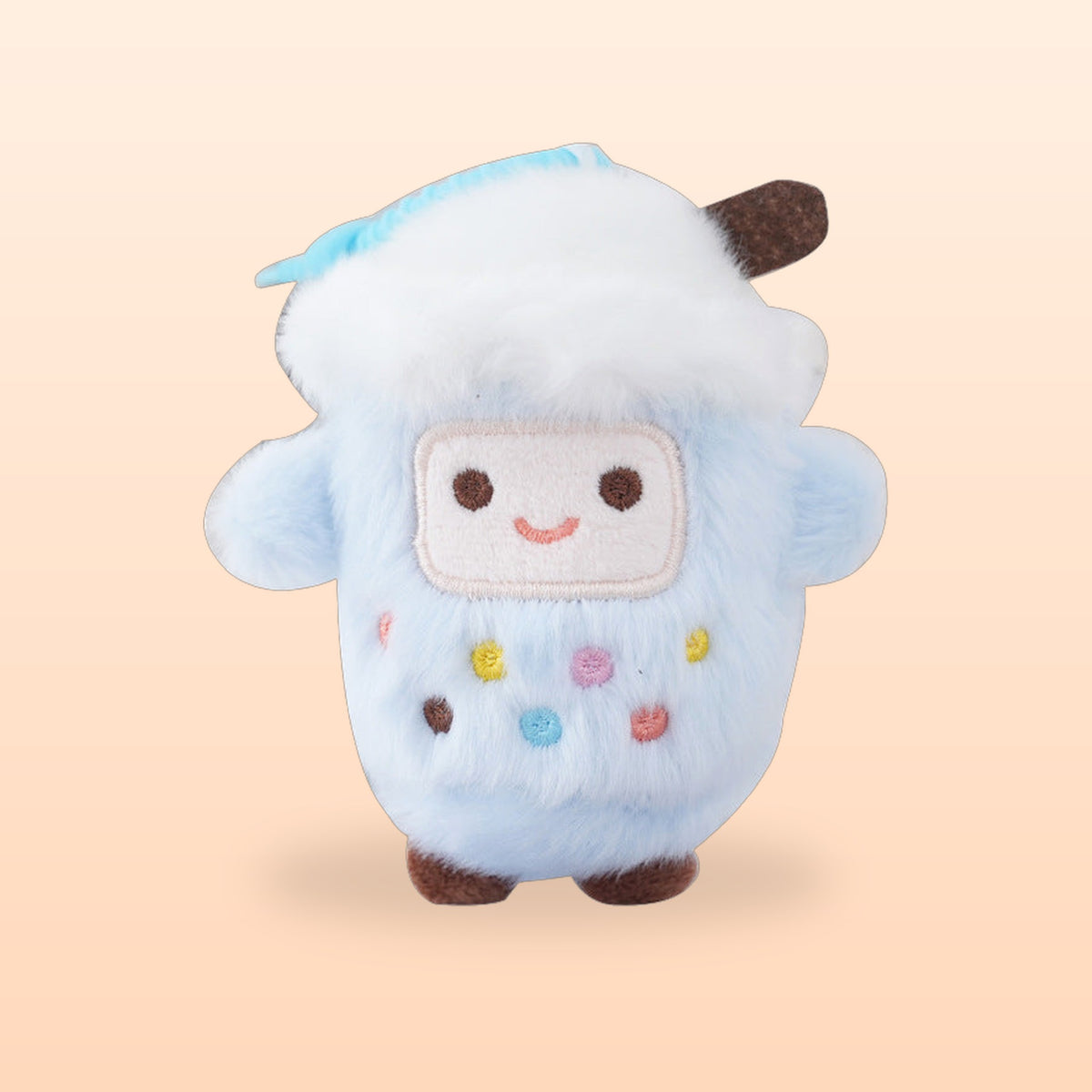 Blueberry bubble tea cup plush keychain, pale blue and fluffy with a smiley face, on a peach background